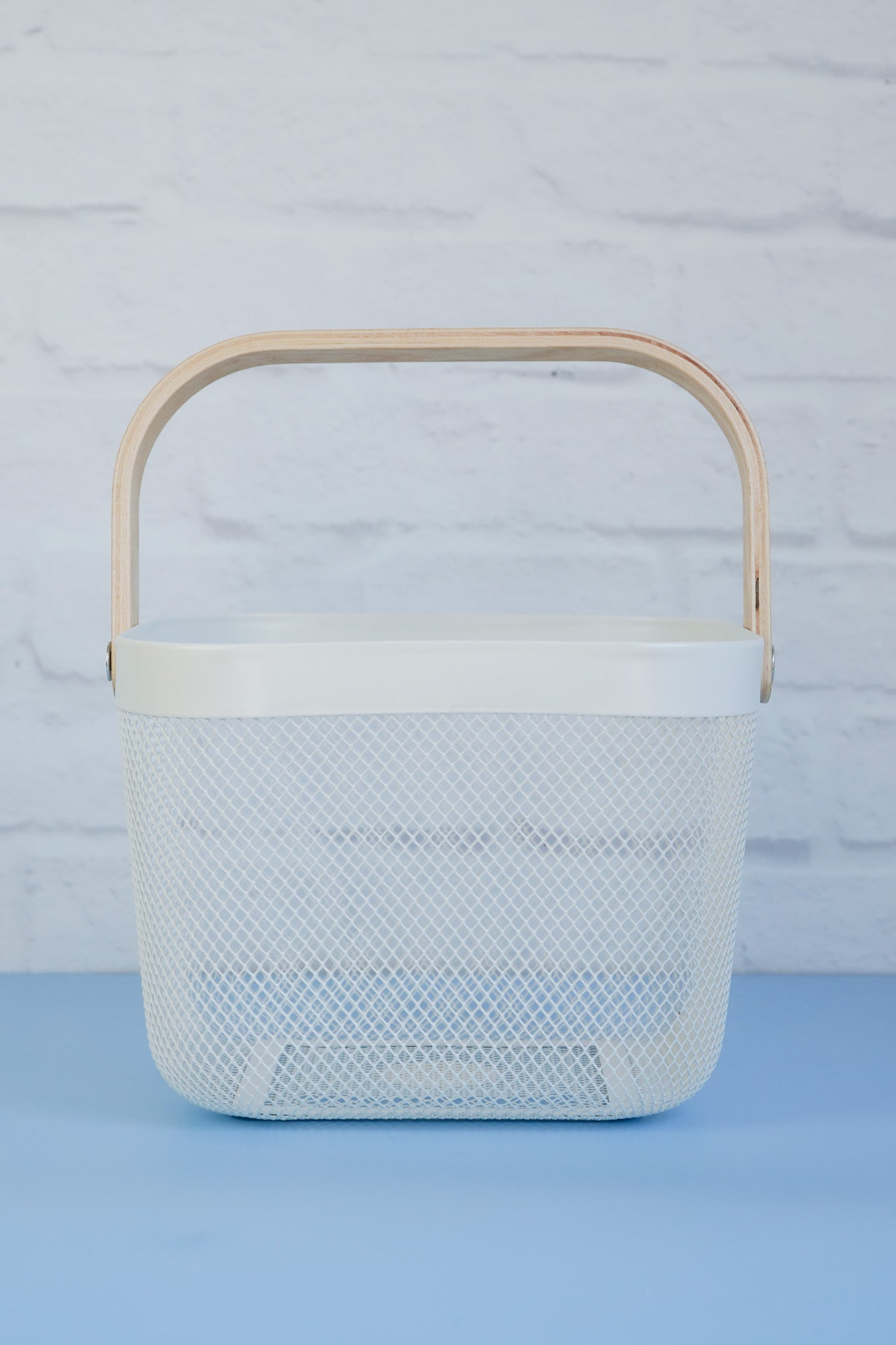 The white mesh basket with wooden handle from The Little Pantry Project.