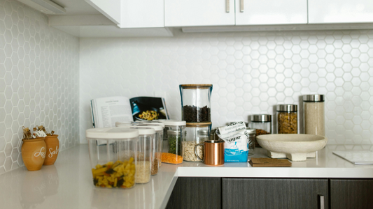 A messy kitchen beach with pantry contents scattered everywhere.